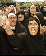 [Iraqi women
protest against sanctions Anti-sanctions]